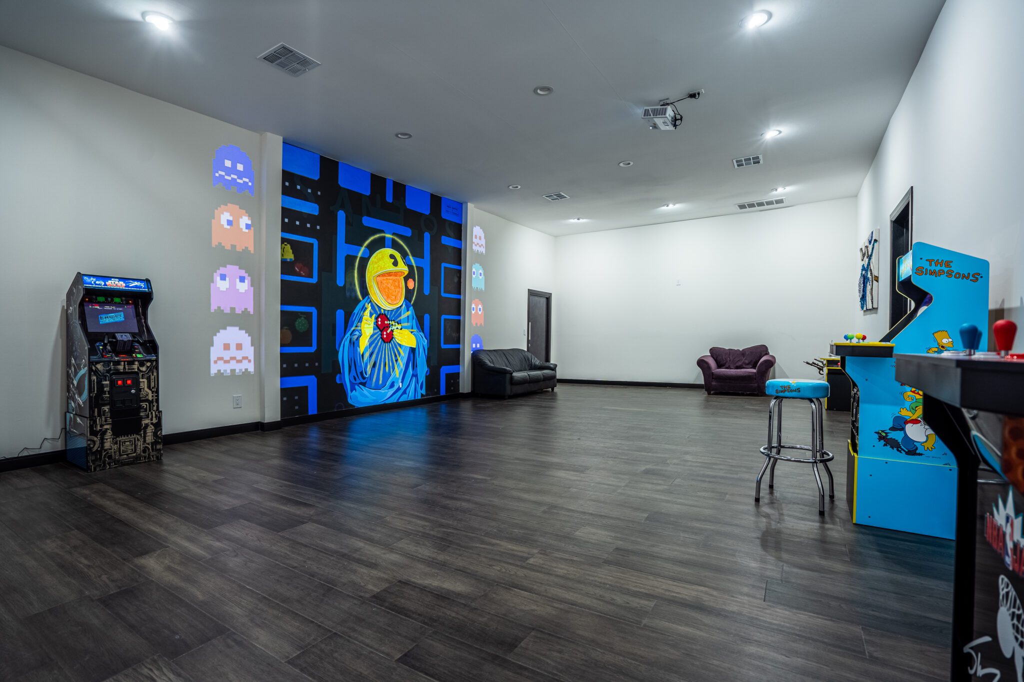 a large open art space with Pac-man inspired art pieces